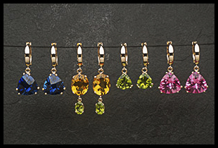 Row of Assorted Dangle Earrings by New Traditions Jewelry